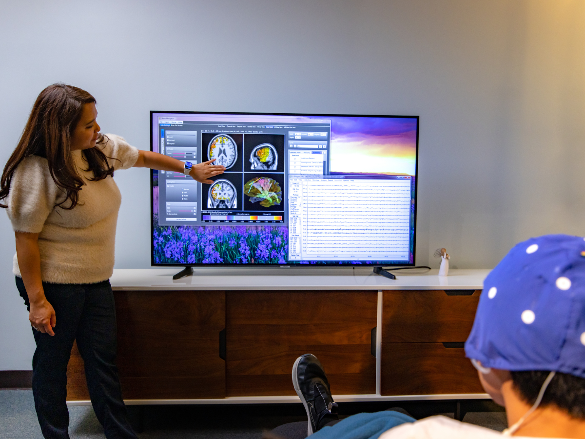 neurofeedback specialist discussing anxiety treatment with a patient